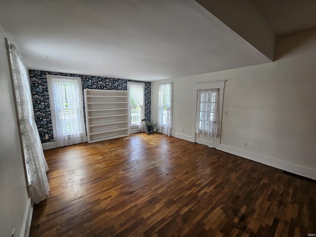 unfurnished room featuring dark wood-type flooring