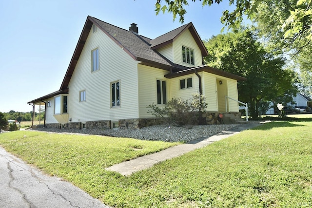 view of property exterior featuring a yard