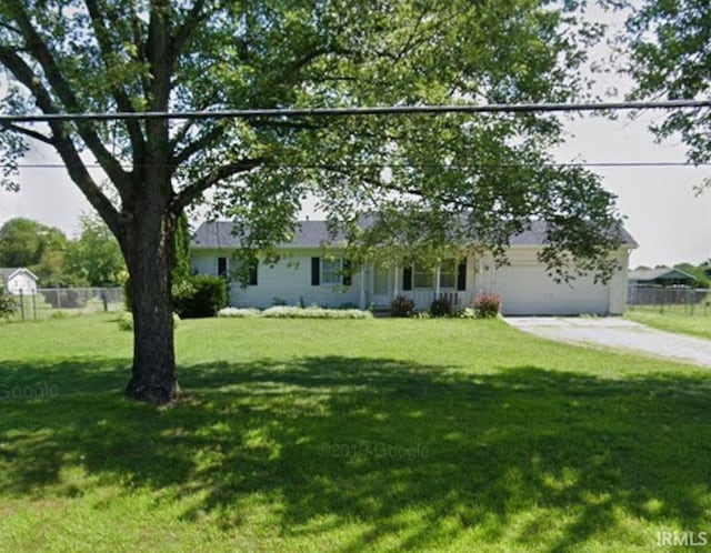 single story home with a garage and a front lawn