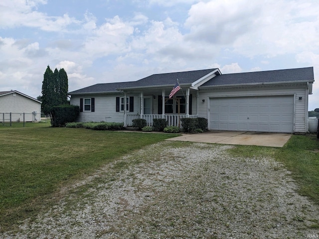 single story home with a porch, a garage, and a front yard