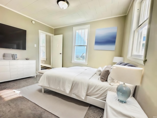 bedroom featuring carpet and crown molding