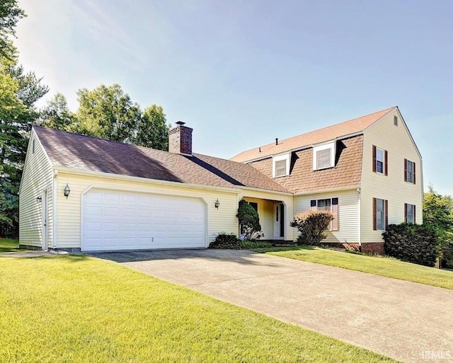 view of front facade featuring a chimney, a shingled roof, a garage, driveway, and a front lawn