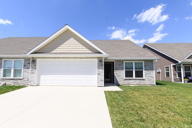 view of front of home featuring a garage and a front yard