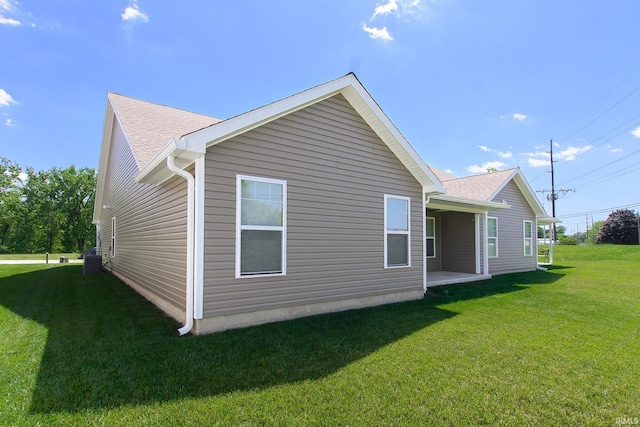 view of property exterior with a yard and cooling unit