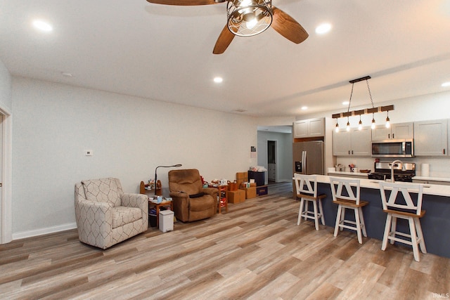 interior space with light hardwood / wood-style flooring and ceiling fan