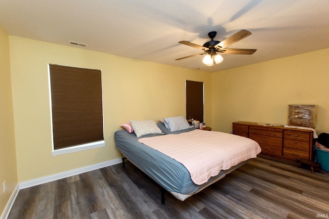 bedroom featuring ceiling fan and dark wood-type flooring