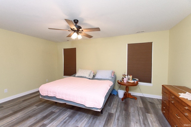 bedroom featuring dark hardwood / wood-style floors and ceiling fan