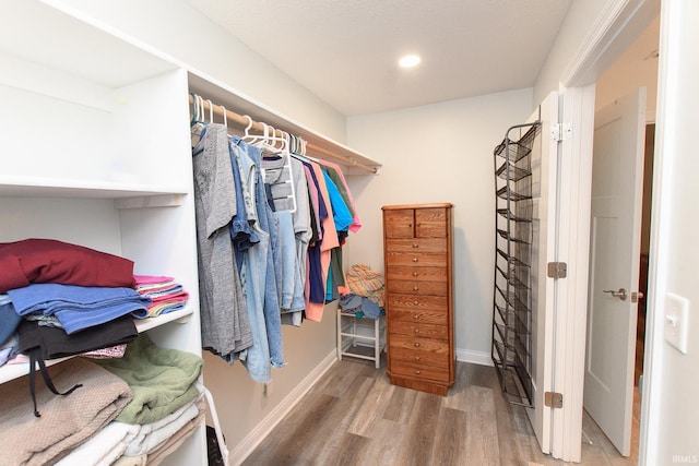 spacious closet featuring hardwood / wood-style floors