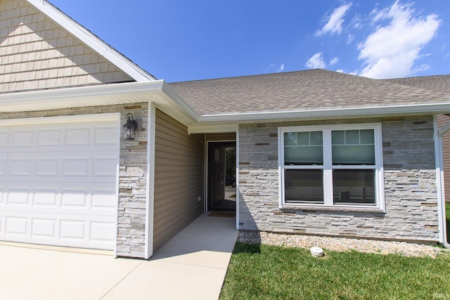 property entrance with a garage