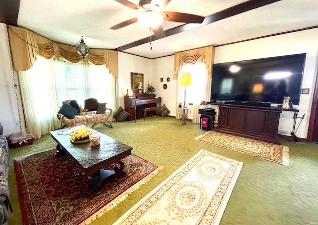 living room with crown molding, a textured ceiling, carpet flooring, and ceiling fan