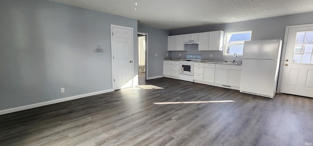 kitchen featuring white cabinetry, white appliances, dark hardwood / wood-style floors, and sink