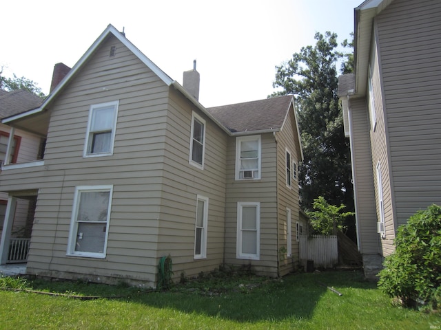 view of property exterior with a lawn