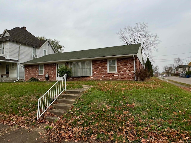 view of front of property with a front lawn