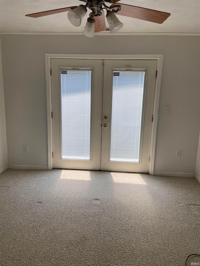 doorway to outside with french doors, carpet flooring, and ceiling fan