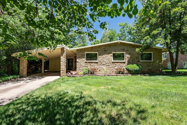 single story home featuring a front lawn and a carport