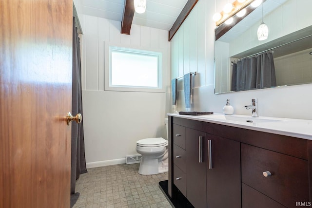 bathroom featuring beamed ceiling, vanity, toilet, and a shower with curtain