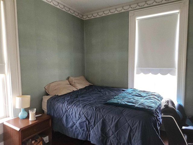 bedroom with ornamental molding