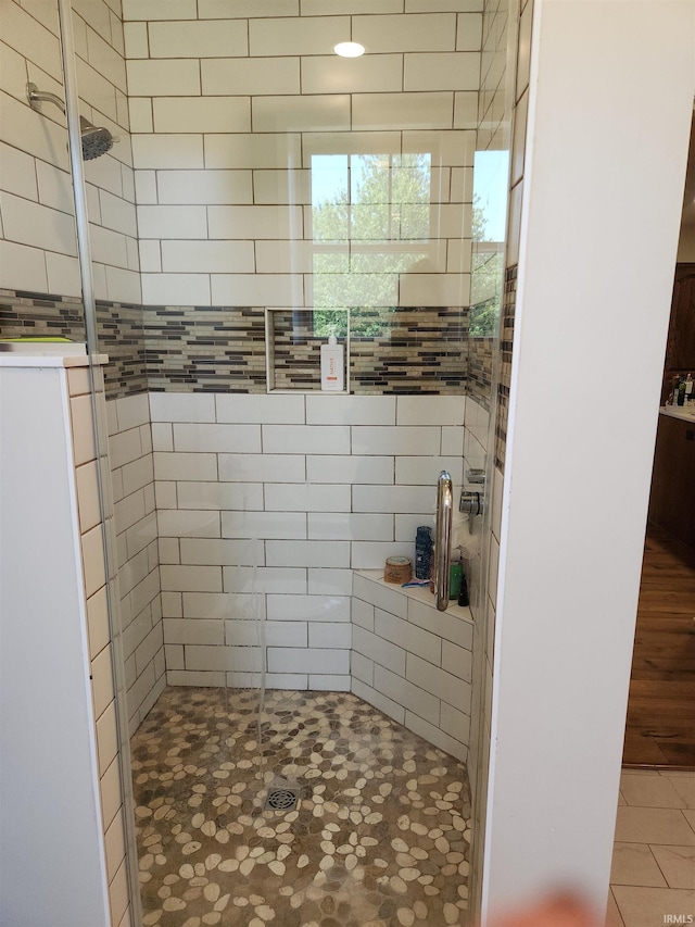 full bathroom featuring a shower stall