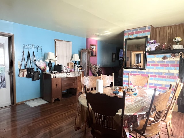 dining area featuring dark wood-type flooring