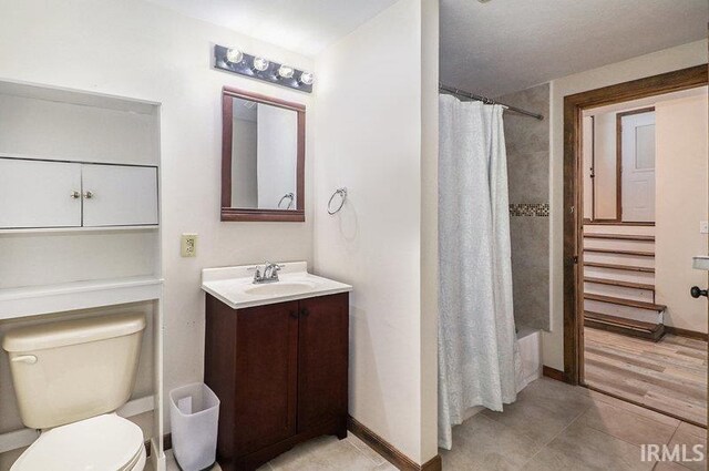 full bathroom with vanity, shower / bath combination with curtain, toilet, and wood-type flooring