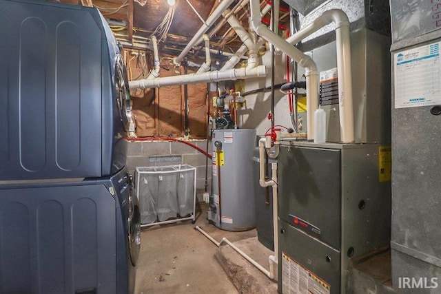 utility room with stacked washer and dryer and water heater