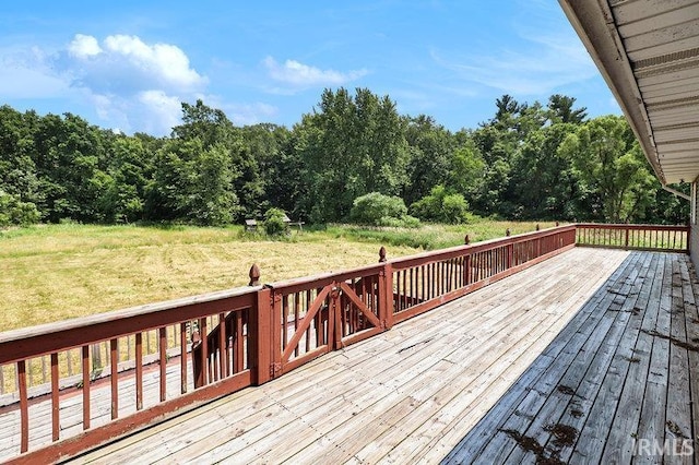 deck featuring a lawn