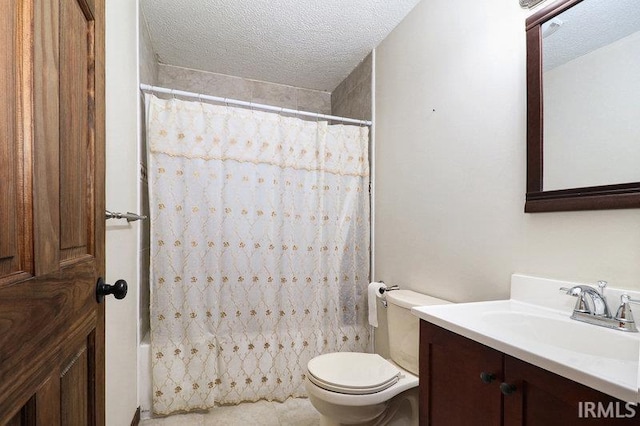 full bathroom featuring vanity, a textured ceiling, toilet, and shower / tub combo with curtain