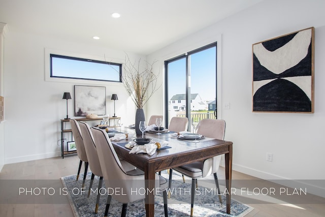 dining area with light hardwood / wood-style flooring