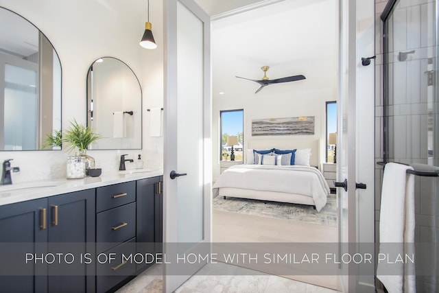 bathroom featuring ceiling fan and vanity