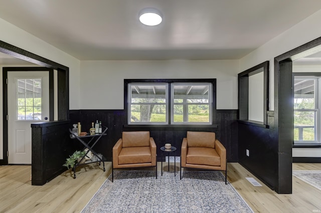 living area with light hardwood / wood-style flooring