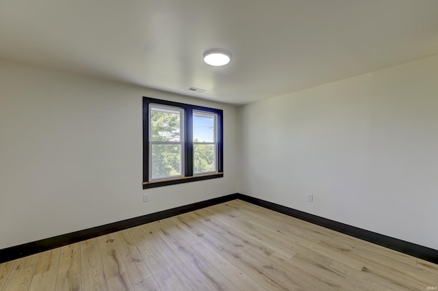 unfurnished room featuring light hardwood / wood-style floors