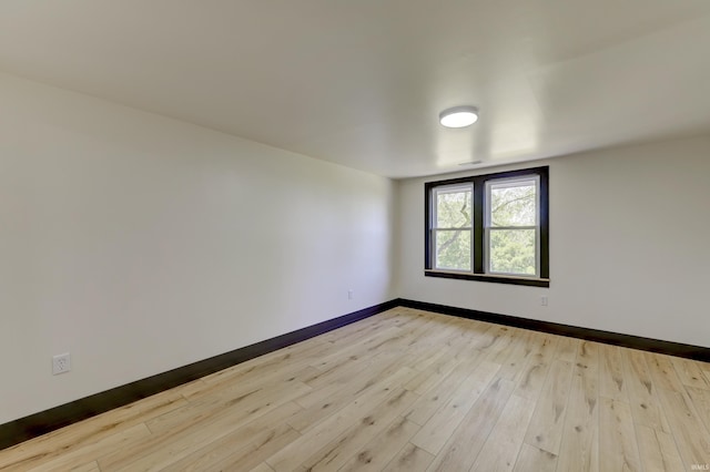 unfurnished room featuring light wood-type flooring