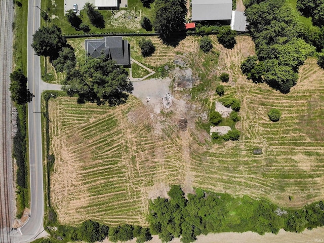 birds eye view of property with a rural view