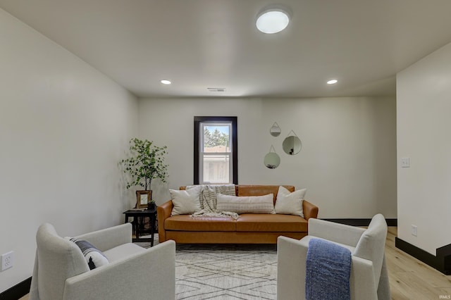 living room with light hardwood / wood-style floors