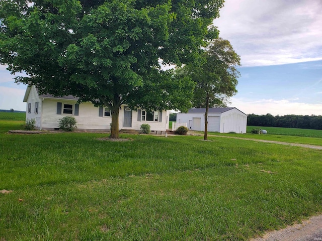 view of front facade with a garage and a front lawn