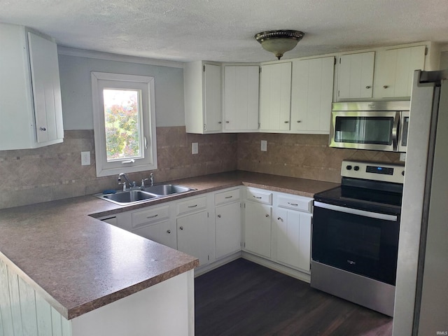 kitchen featuring white cabinets, dark hardwood / wood-style flooring, sink, and stainless steel appliances