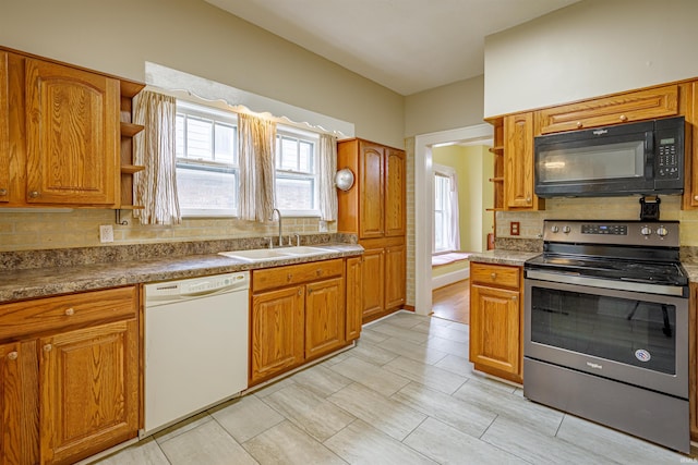 kitchen with white dishwasher, stainless steel electric range, sink, and tasteful backsplash