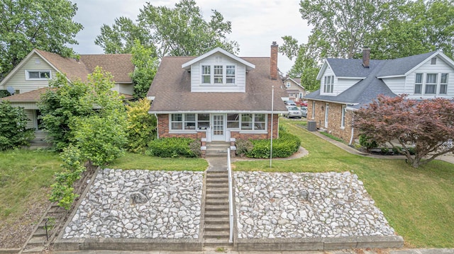 new england style home featuring a front yard and central AC