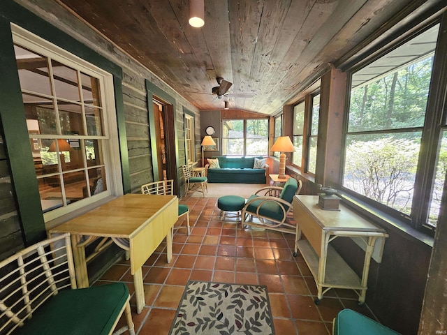 sunroom with ceiling fan, wooden ceiling, and lofted ceiling