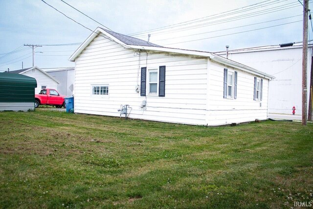 view of property exterior featuring a lawn