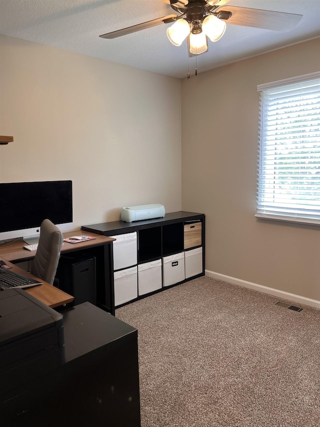 office with ceiling fan and light carpet