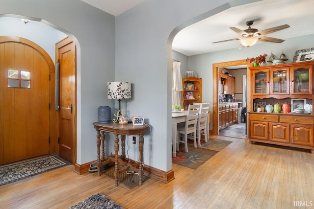 entryway featuring light wood-type flooring and ceiling fan