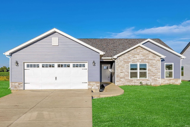 view of front facade featuring a front lawn and a garage