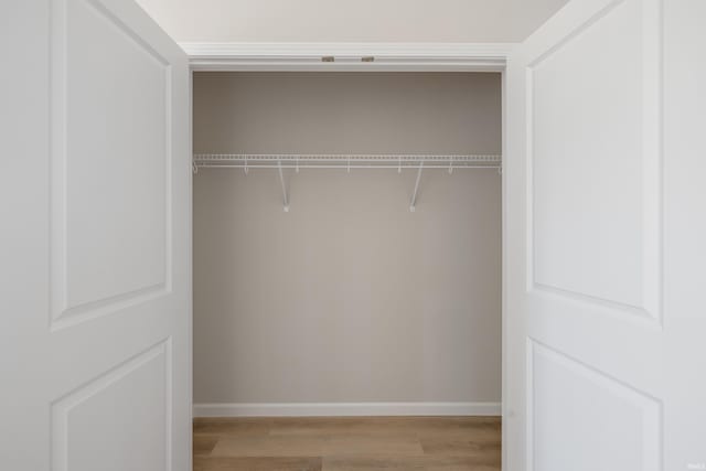 laundry room featuring light hardwood / wood-style floors and hookup for a washing machine