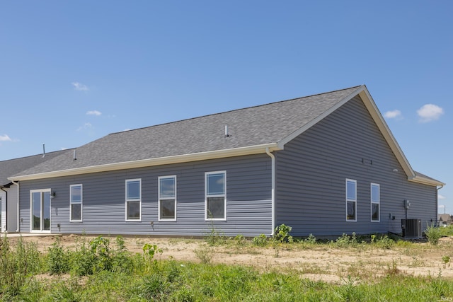 rear view of house with central AC