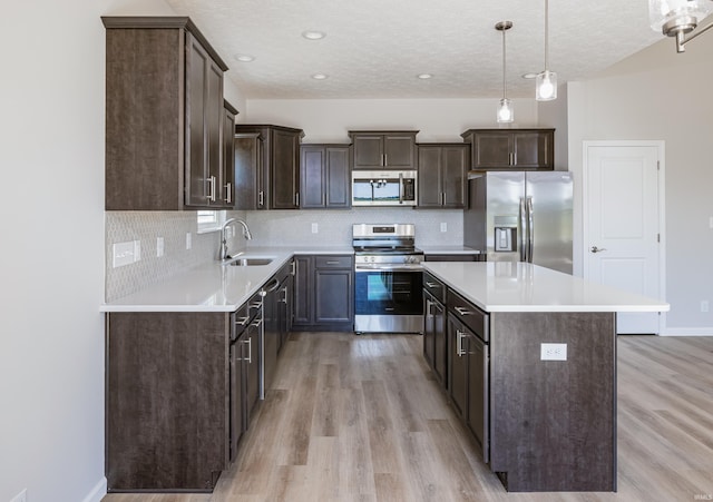 entrance foyer featuring light hardwood / wood-style flooring and an inviting chandelier