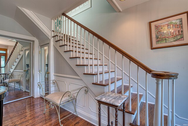 stairs with wood-type flooring