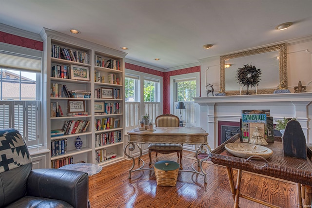 office area featuring hardwood / wood-style floors and ornamental molding