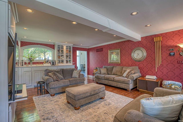 living room with beam ceiling, crown molding, and dark wood-type flooring