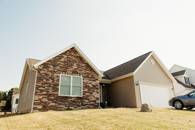 front of property featuring a front yard and a garage